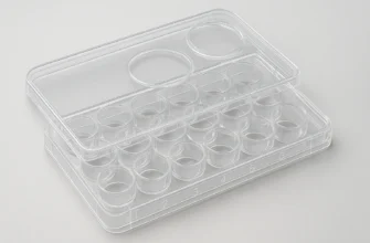 Close-up of a 24-well cell culture plate with alphanumeric coding and a non-reversible lid