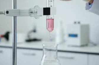 Close-up of a chemist reading the meniscus on a glass buret during titration